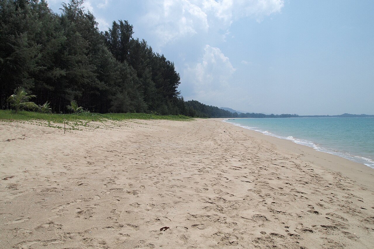 Long empty beach at Khao Lak at golden hour